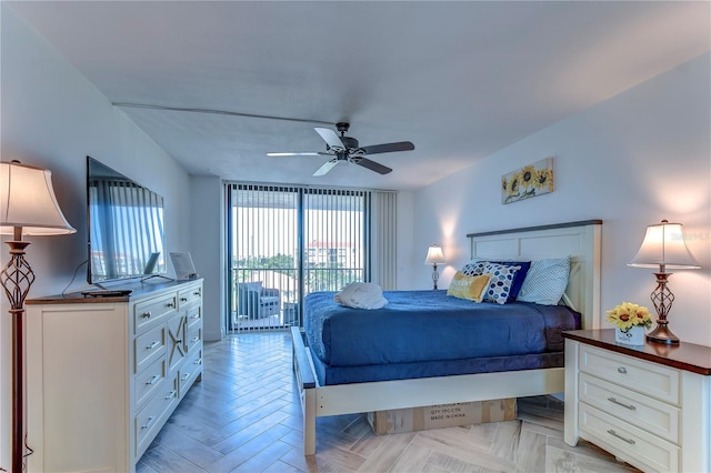 bedroom with access to outside, ceiling fan, and light parquet floors