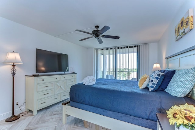 bedroom with light parquet floors, access to outside, and ceiling fan