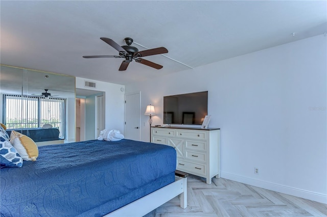 bedroom with light parquet flooring and ceiling fan