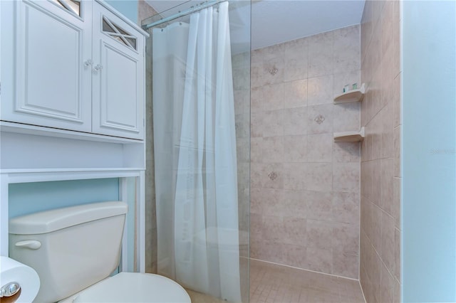 bathroom featuring walk in shower and toilet