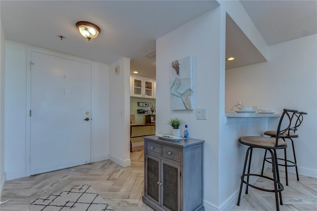 foyer entrance with light parquet floors