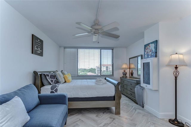 bedroom featuring light parquet flooring and ceiling fan