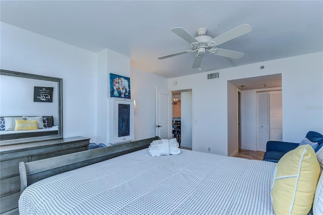 bedroom featuring a closet, ceiling fan, and hardwood / wood-style flooring