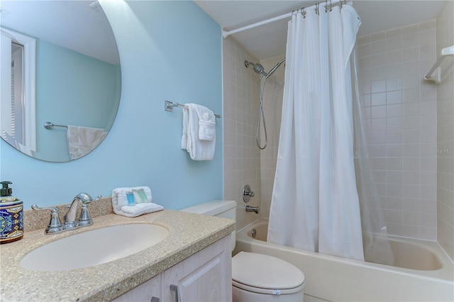 full bathroom featuring vanity, shower / bath combo, and toilet