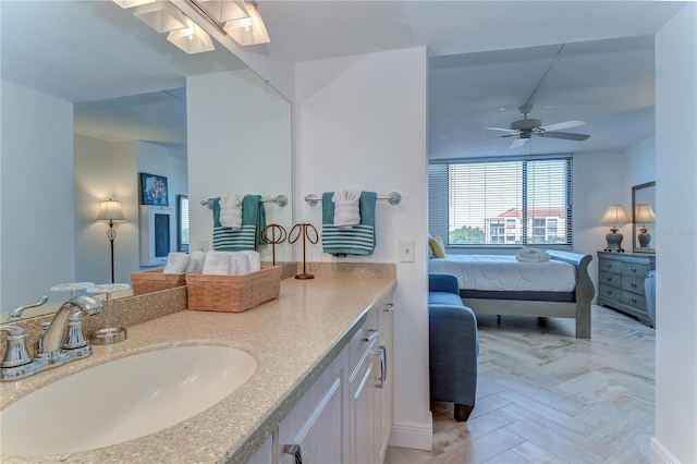 bathroom featuring vanity, parquet flooring, and ceiling fan