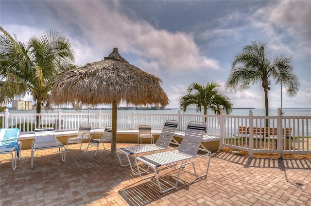 view of patio with a water view