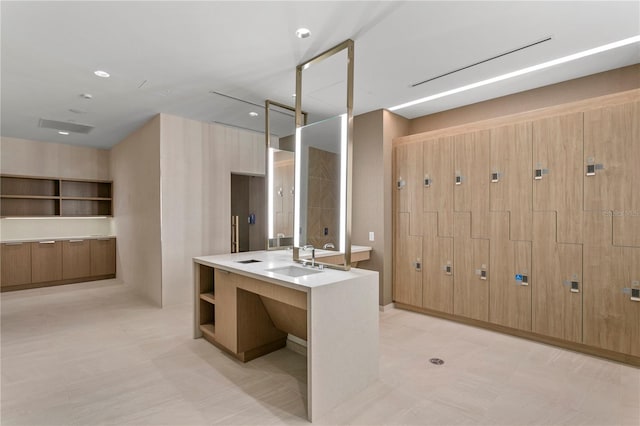 bathroom with vanity and tile flooring