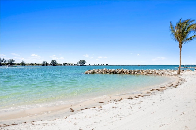 property view of water featuring a beach view