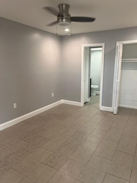 unfurnished bedroom featuring ceiling fan and light tile floors