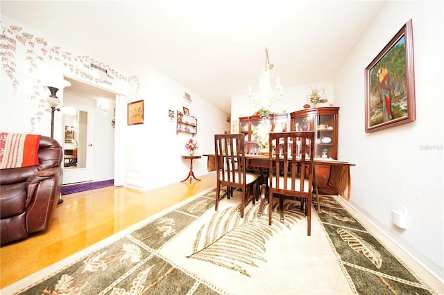 dining room with a notable chandelier