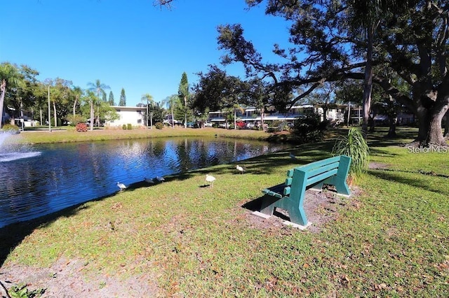 exterior space featuring a water view and a yard