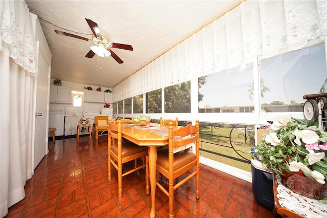 dining area featuring ceiling fan, a textured ceiling, and washer / dryer