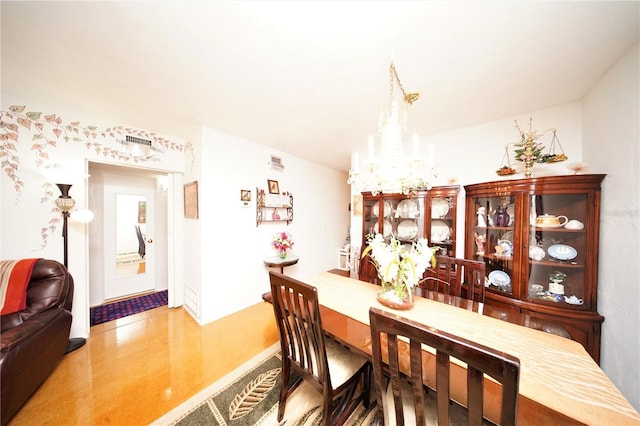 dining space featuring a chandelier