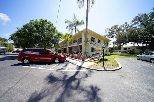 view of property with uncovered parking