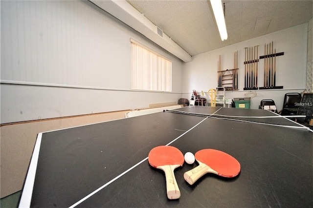 playroom featuring a textured ceiling