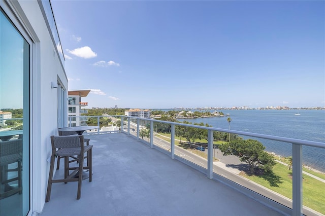 balcony featuring a water view