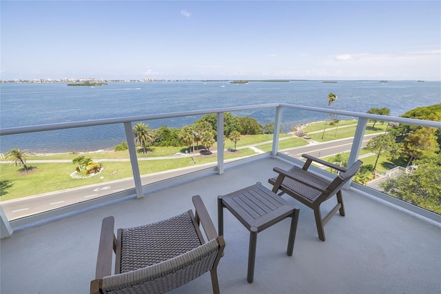 balcony featuring a water view