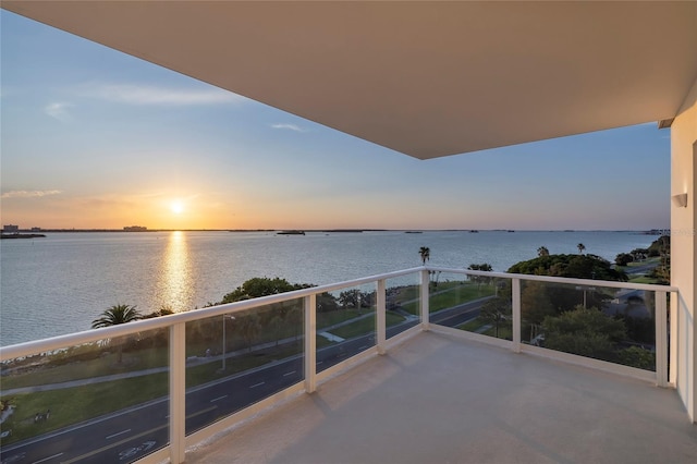 balcony at dusk with a water view