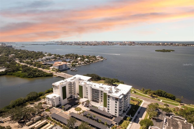 aerial view at dusk with a water view