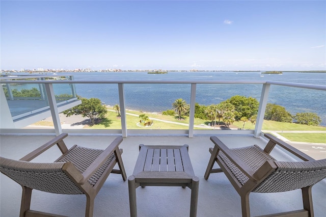 balcony featuring a water view