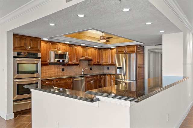 kitchen with stainless steel appliances, tile patterned floors, and ornamental molding