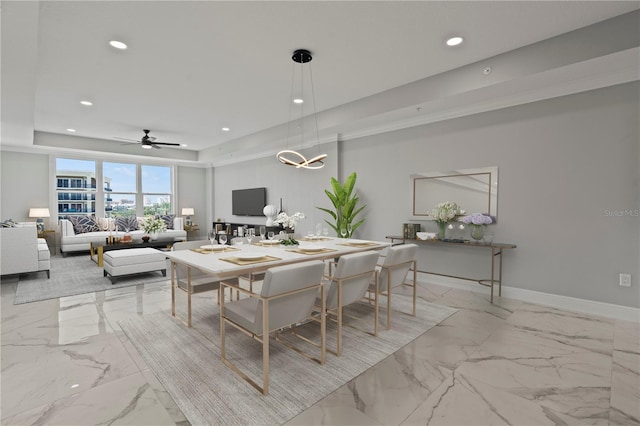 dining space featuring a tray ceiling