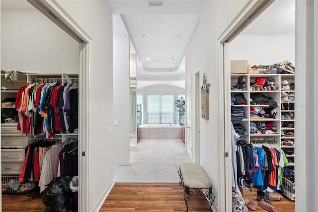 spacious closet with light hardwood / wood-style floors