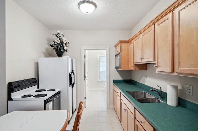 kitchen with a textured ceiling, white appliances, light brown cabinetry, and sink