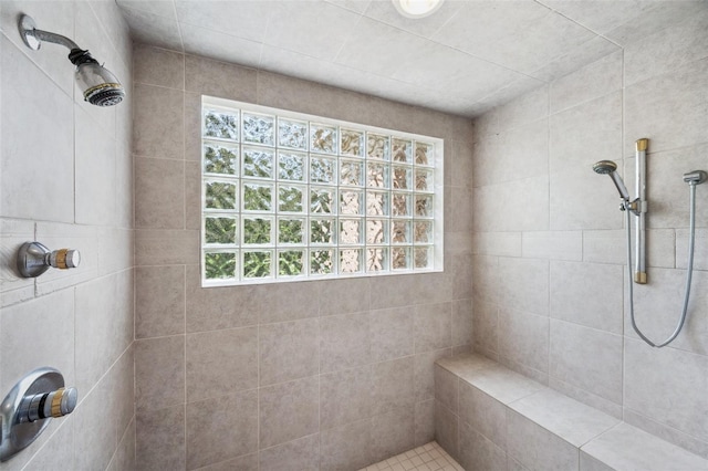 bathroom with tiled shower