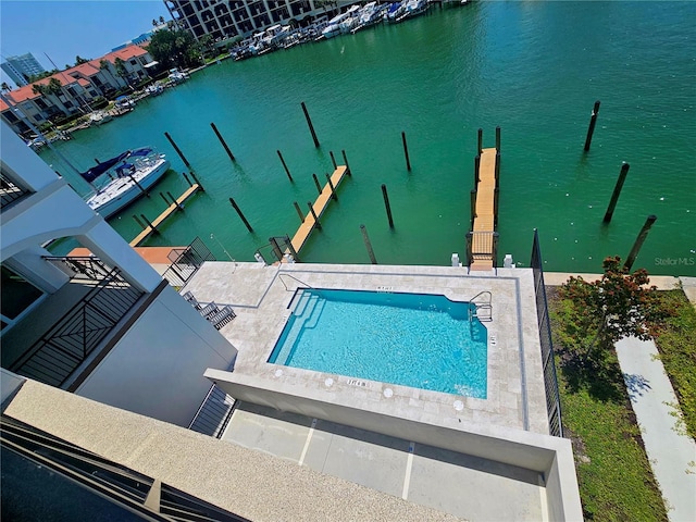 exterior space with a water view and a patio area