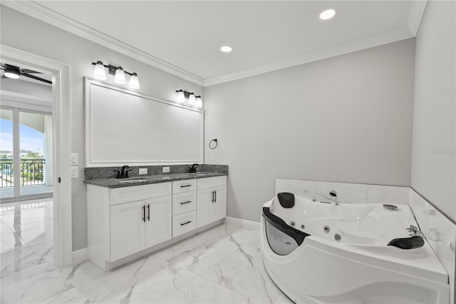 bathroom with vanity, a tub to relax in, crown molding, and ceiling fan