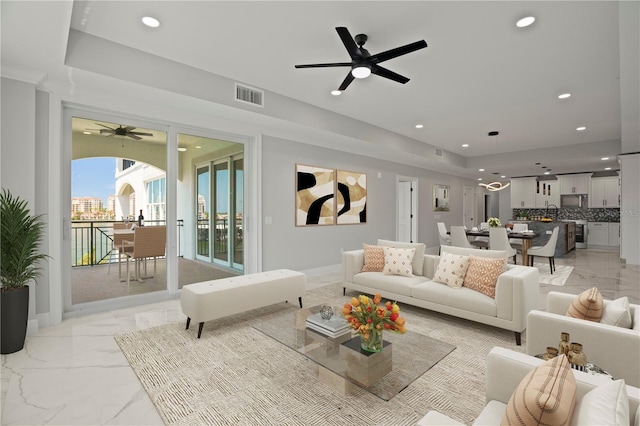 living room with ceiling fan