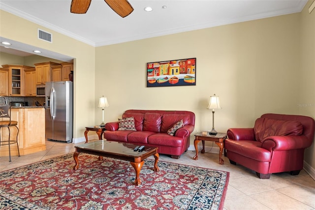 tiled living room with crown molding and ceiling fan