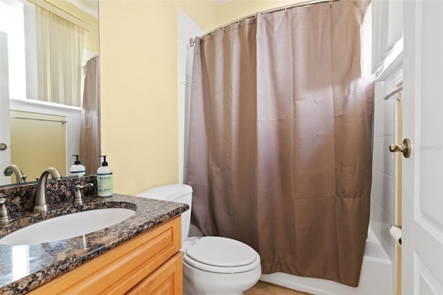 full bathroom featuring shower / bath combo, toilet, vanity, and tile flooring