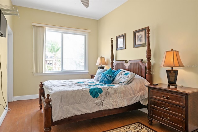 bedroom featuring ceiling fan and dark wood-type flooring