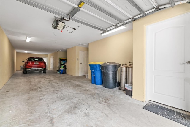 garage featuring a garage door opener