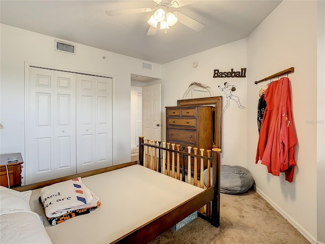 bedroom featuring a closet, ceiling fan, and light colored carpet