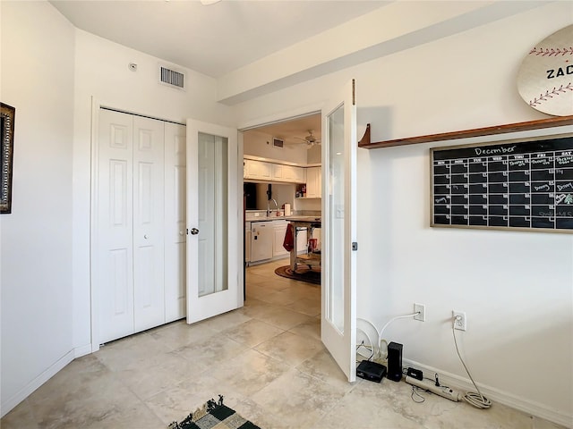 interior space featuring light tile floors and sink