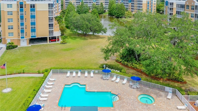 view of nearby features featuring a lawn, a patio area, and a pool