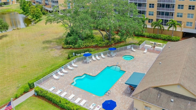 view of swimming pool with a patio and a yard