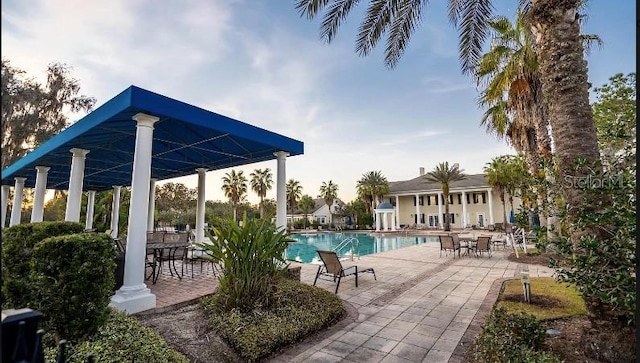 view of swimming pool with a patio