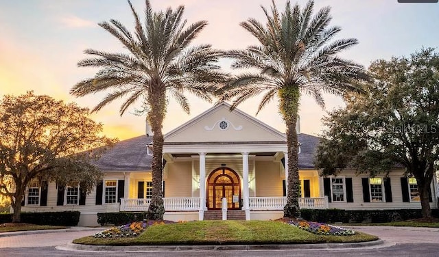 view of outdoor building at dusk