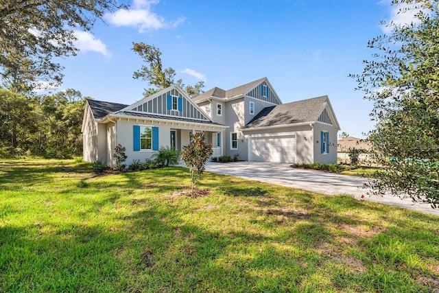 view of front of property with a garage and a front lawn