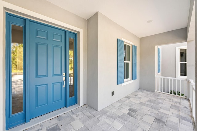 entrance to property featuring covered porch