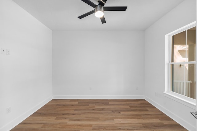 unfurnished room with ceiling fan and wood-type flooring