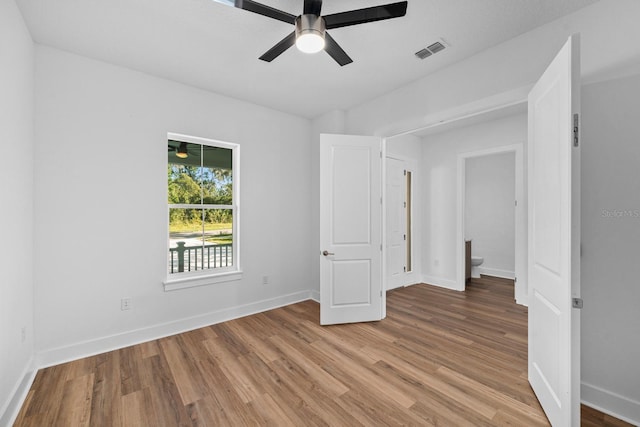 unfurnished bedroom featuring ceiling fan and light hardwood / wood-style floors