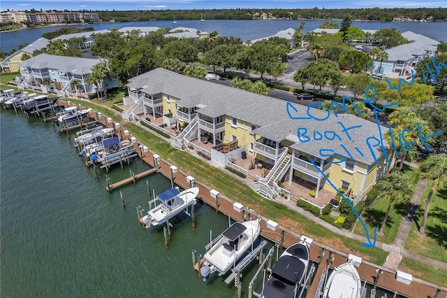 birds eye view of property featuring a water view