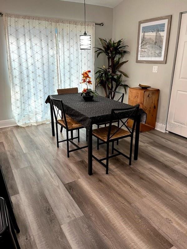 dining area featuring wood-type flooring