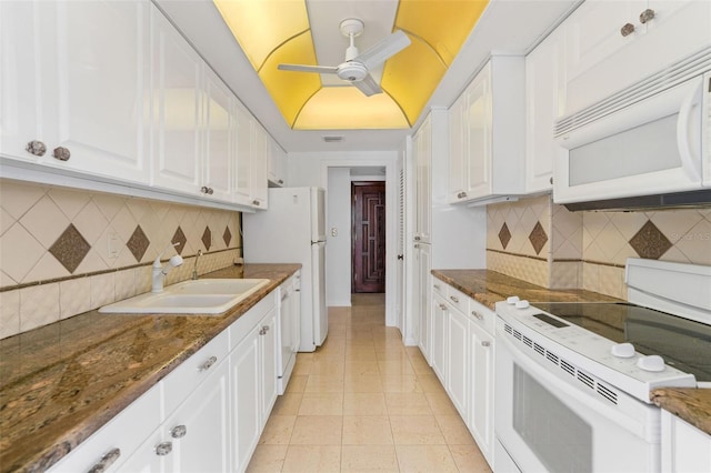 kitchen featuring ceiling fan, sink, white appliances, and decorative backsplash