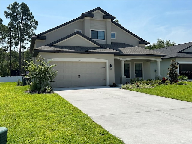 view of front facade with a garage and a front yard